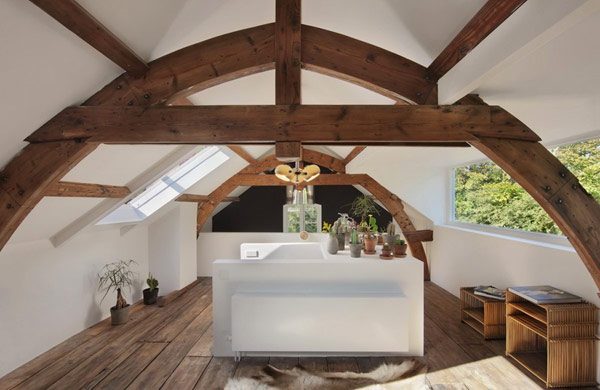 Historical-Home-Design-White-Attic-Space-With-Wooden-Floor-Curved-Pole