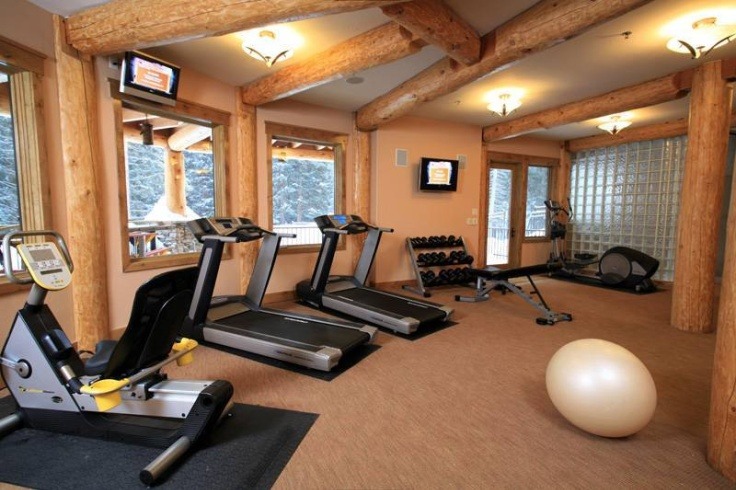 elegant-home-gym-designs-with-portable-fitness-equipment-training-equipments-combined-with-space-for-aerobic-exposed-ceiling