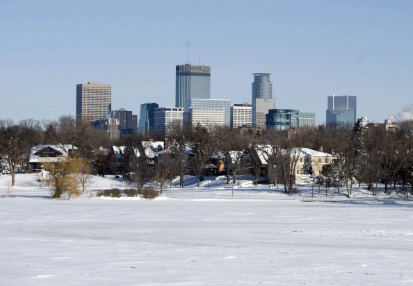 downtown skyline is seen from across Lake Calhoun after a snow storm 