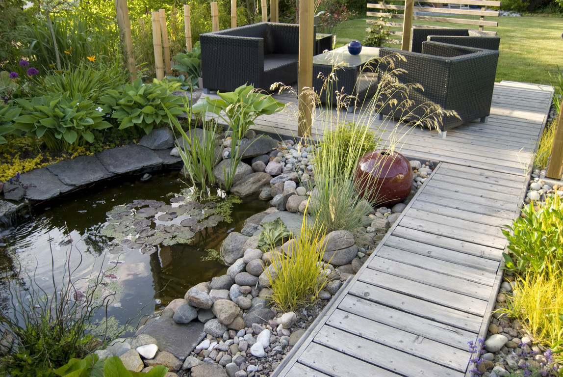 backyard-with-awesome-small-pond-idea-feat-gravel-garden-and-trendy-furniture-set-for-outdoor-living-room