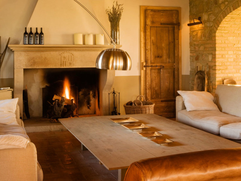 classic-fireplace-with-white-sofa-and-stainless-steel-arch-lamp-and-also-rustic-door-800x604