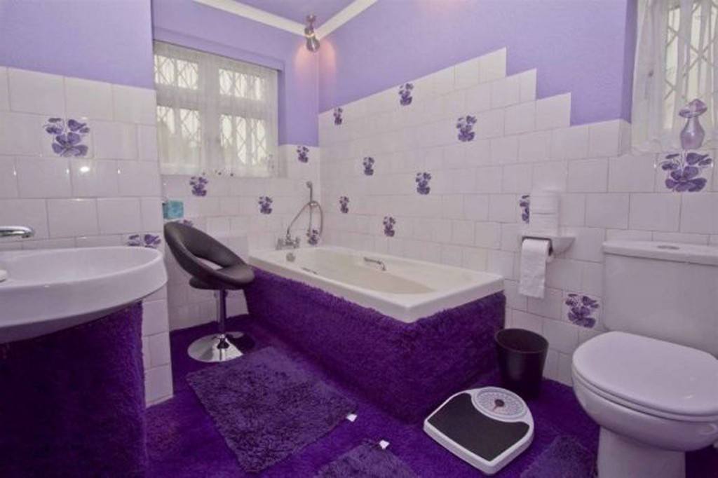 beautiful-white-and-purple-beautiful-looking-tub-bathroom-with-violet-flower-bathroom-tiles-design-rectangular-white-marble-tub-and-purple-carpeting-climbs-all-the-way-up-the-side-of-the-tub-curve-bl