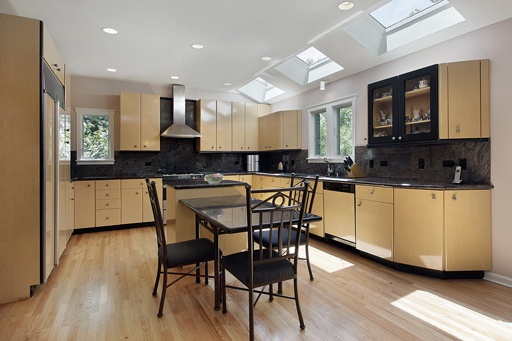 Kitchen in modern home with three skylights