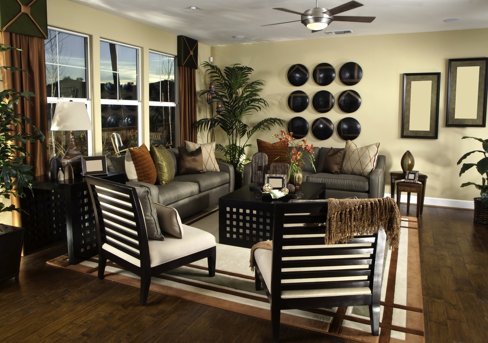 easy-on-the-eye-earth-tone-living-room-with-black-color-combination-and-modern-decoration-with-hanging-metal-fan