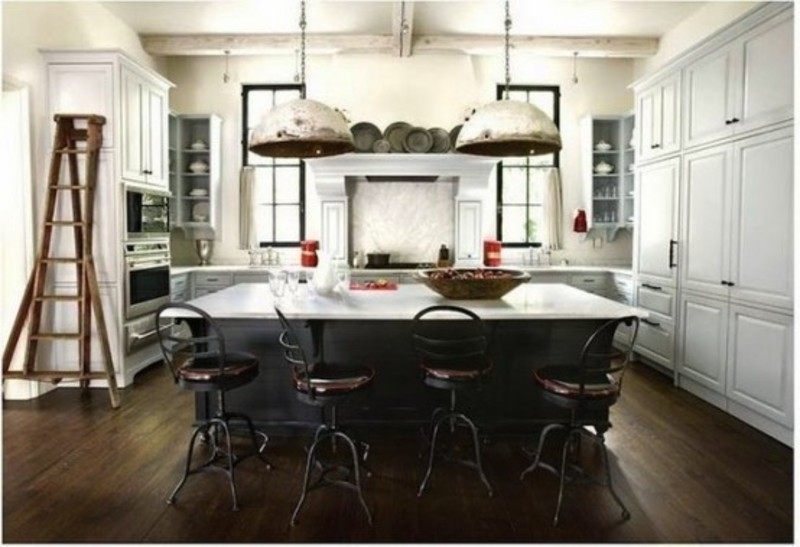 A kitchen island may seem a basic element in a new kitchen, but the choices and details can be overwhelming.For the chef sophisticate, this creative kitchen island adds a grounding center and more of a cooking-slash-social gathering space rather than storage. And for a bit of contrast, the outer kitchen islands rich brown countertop warmly offsets the center islands white surface, as well as the marble kitchen backsplash.