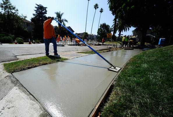 Man cleaning city sidewalk