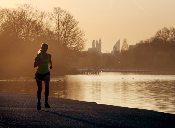 women jogging near water