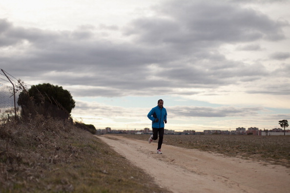 Man jogging down country road