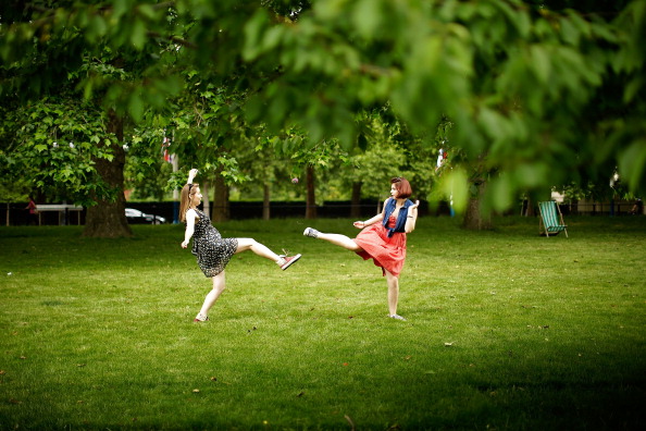 Kids Playing In The Grass