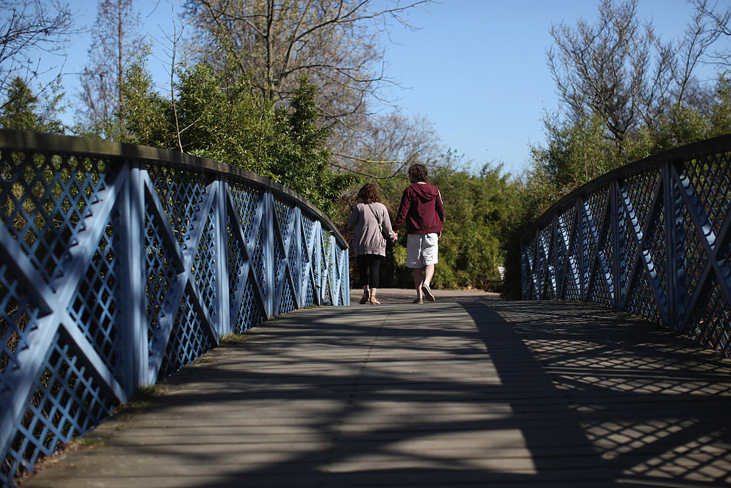 People running across bridge