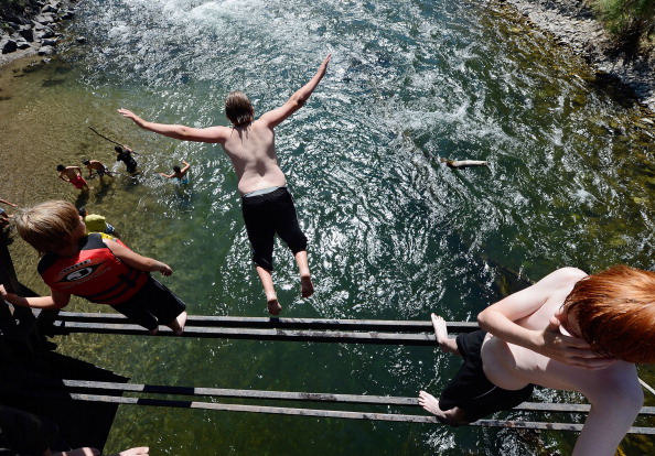 person diving into the Big Wood River