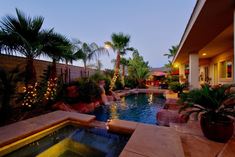 backyard swimming pool with square hot tub