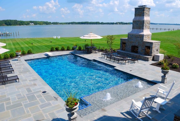 backyard swimming pool with bubbling fountain