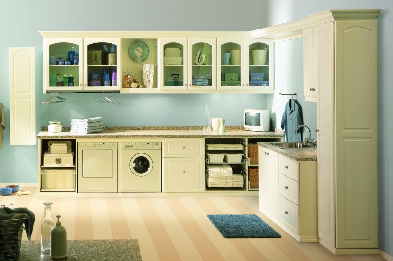 pale color laundry room with small washing machine