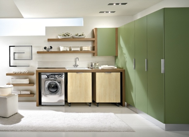 Modern laundry room with oversized green cabinets