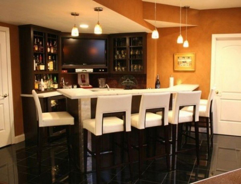 Modern bar with white leather bar stools