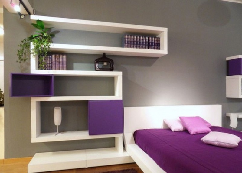 purple and white floating shelves attached to bed