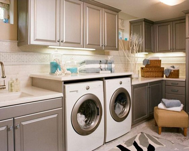 laundry room with silver cabinets