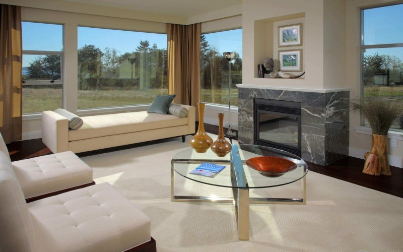 living room with glass table and white chaise