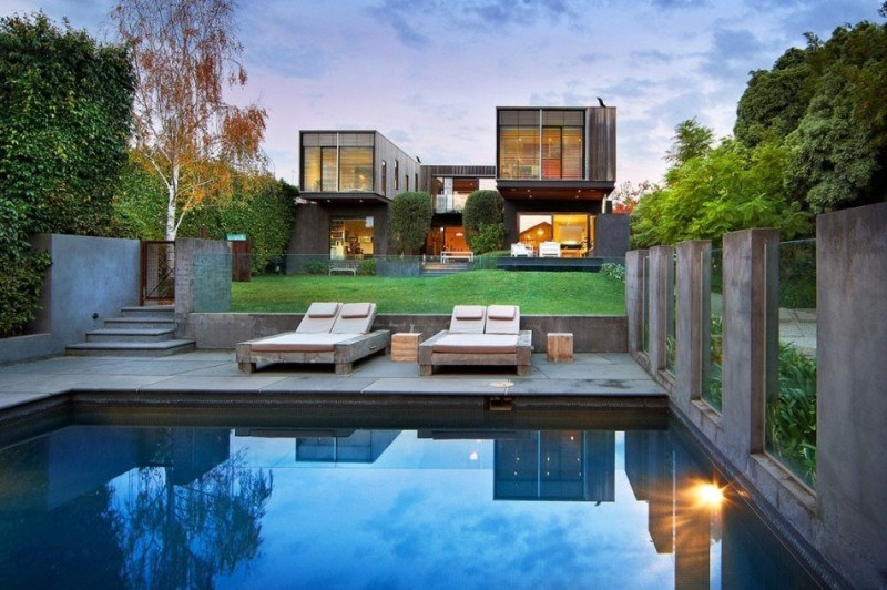 backyard swimming pool with cement deck