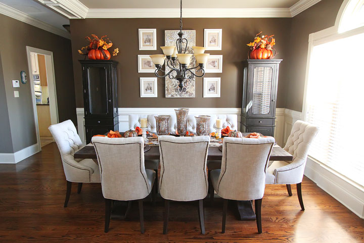 dining room with pumpkins on display