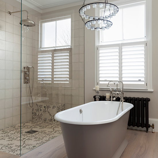 bathroom with unique chandelier