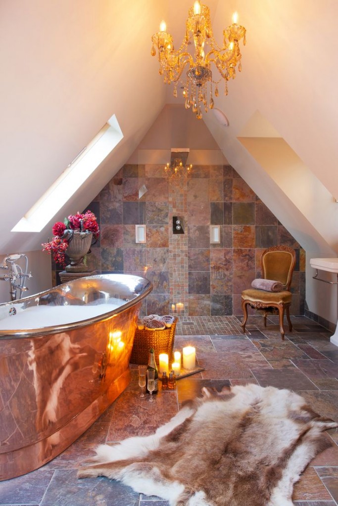 bespoke bathroom with gold tub and chandelier