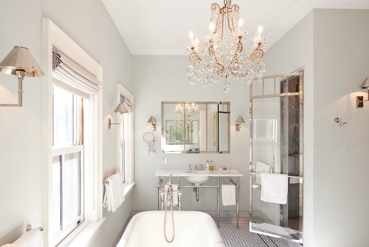 white bathroom with gold chandelier