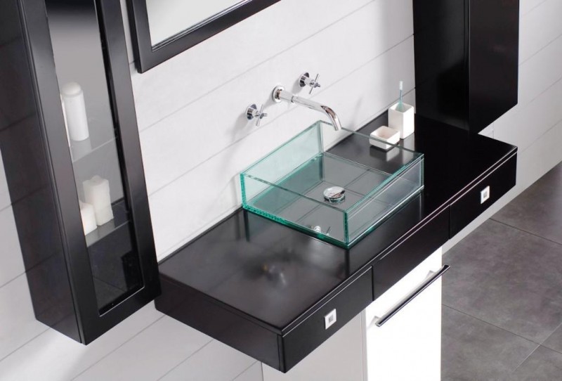 floating glass bathroom sink with black vanity