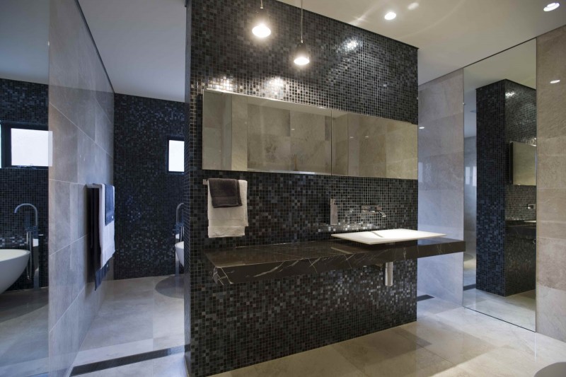 black bathroom with floating sink