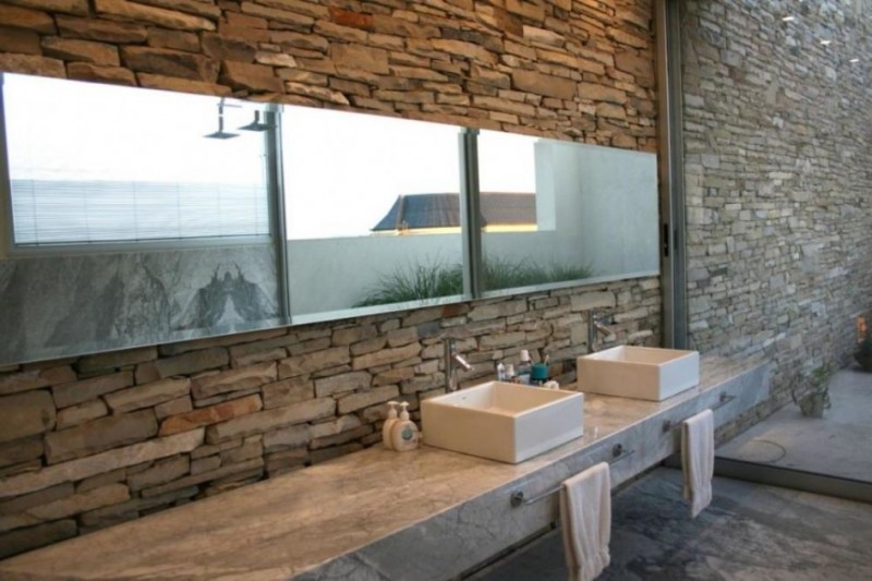 bathroom with natural stone walls