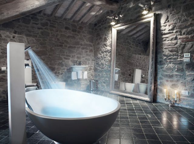 bathroom with all stone walls