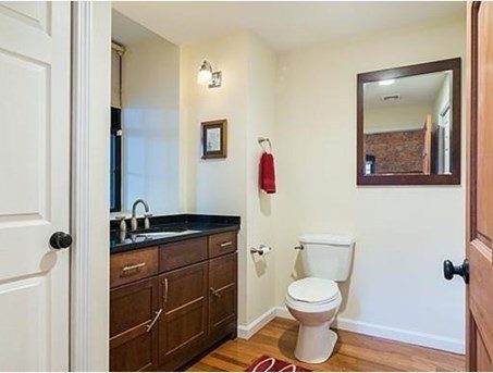 bathroom with dark wood cabinets