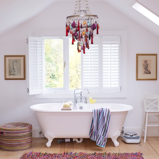 bathroom with colorful chandelier