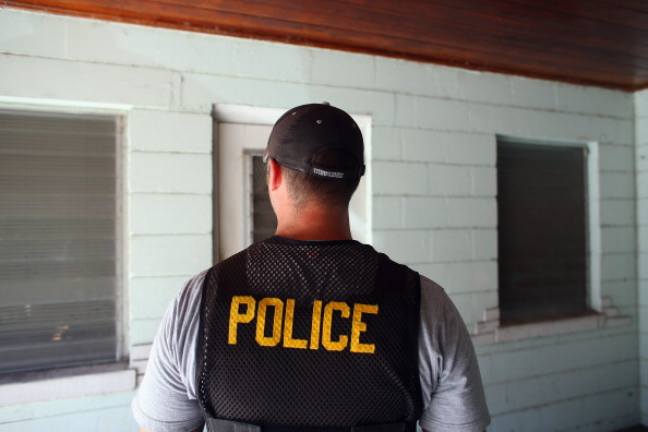 Police officer stands near crime scene