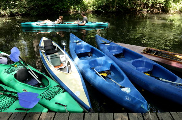 kayaks waiting by the dock