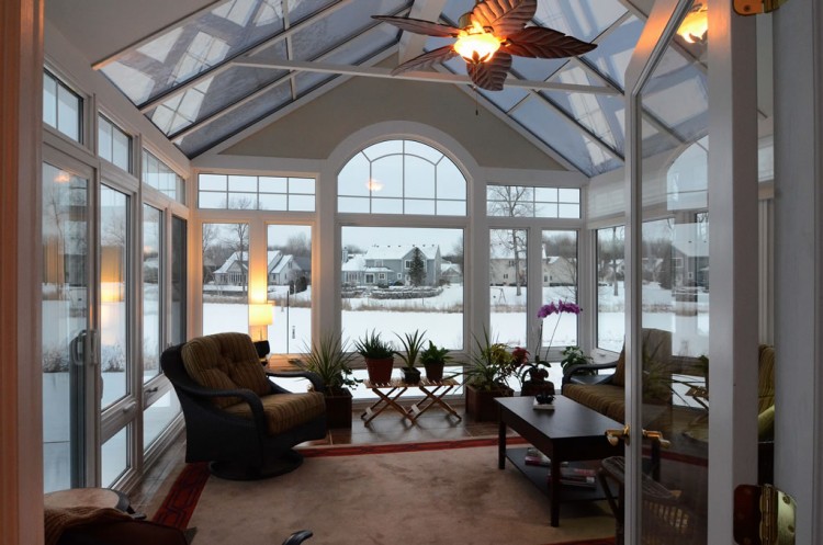 glass covered patio with high ceilings