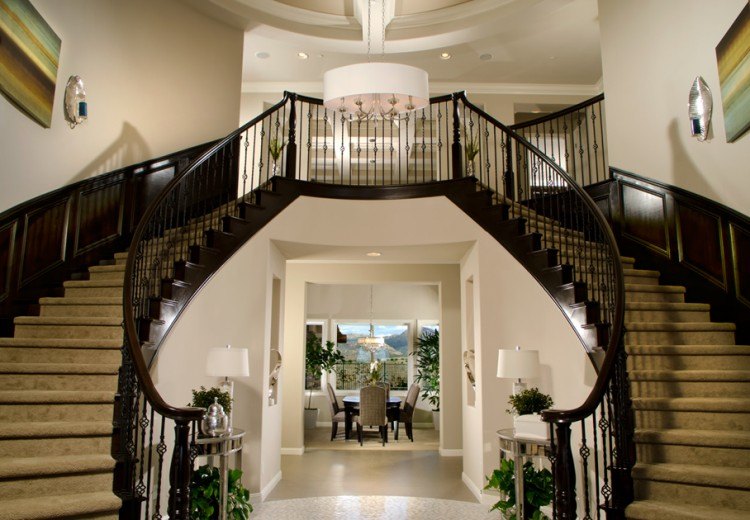 stunning foyer with double staircase design