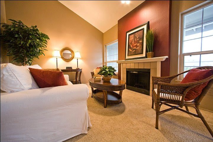 living room with red accent wall