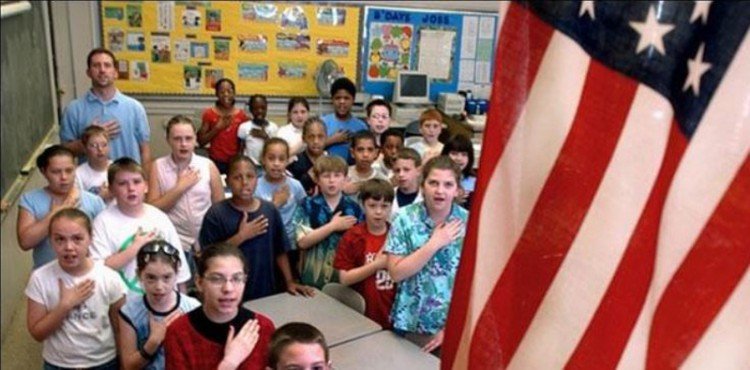 students saying the pledge of allegience