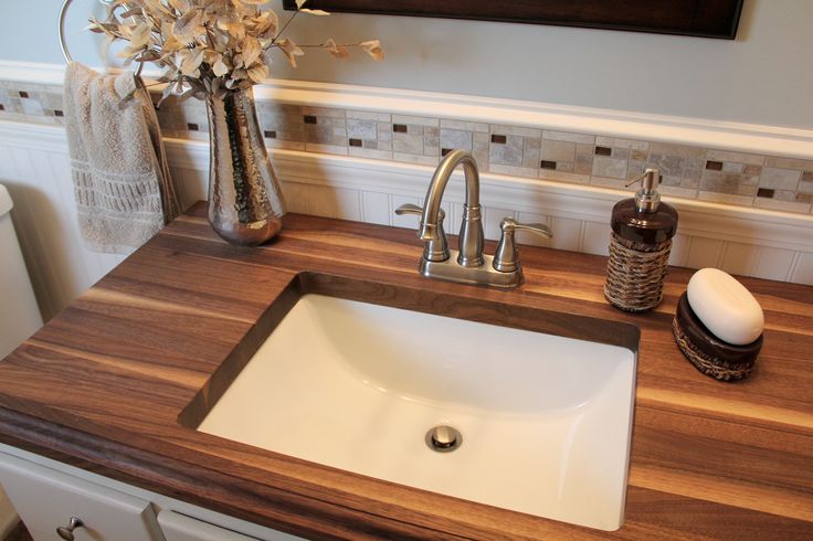 bathroom with wooden countertops