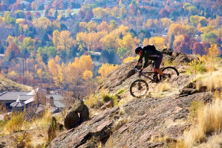 man mountain biking in boise id