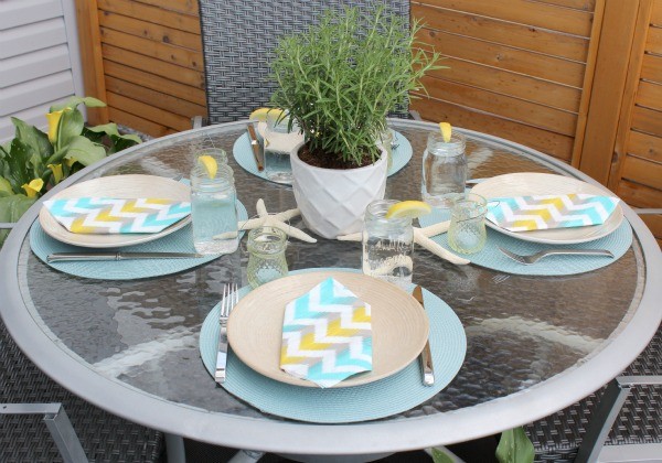 glass table with summer setting