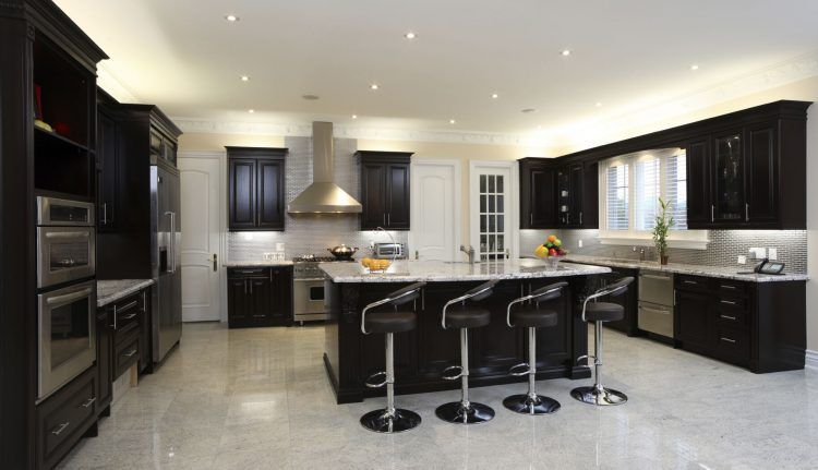 black kitchen with stools