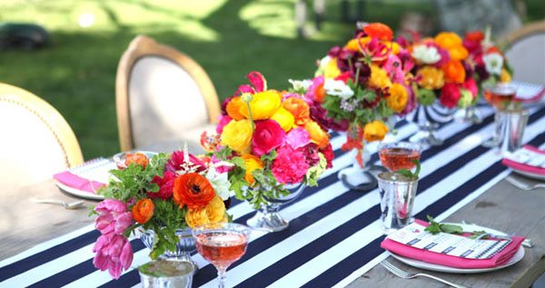 summer table setting with colorful flowers