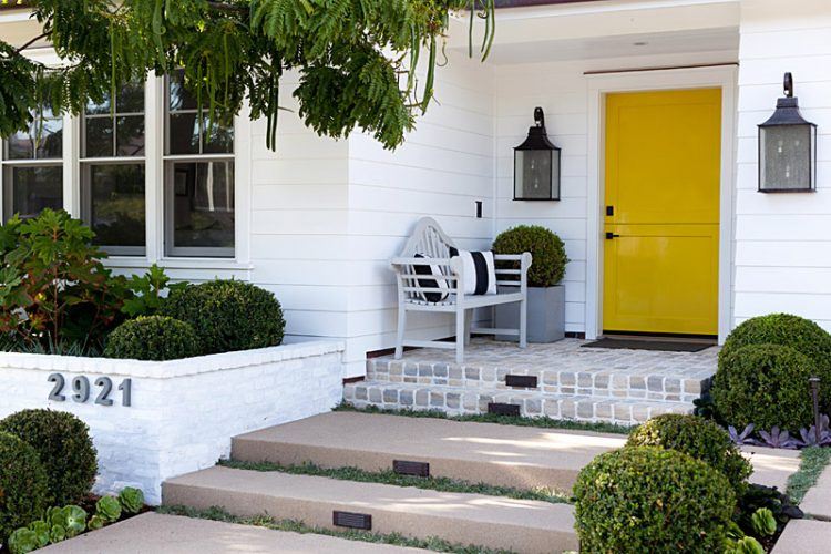 yellow front door with cool porch