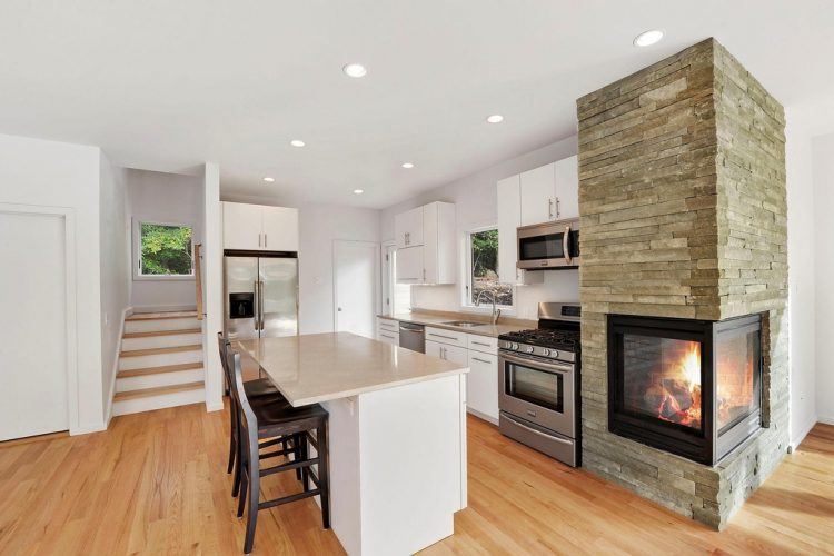 contemporary kitchen with unique fireplace