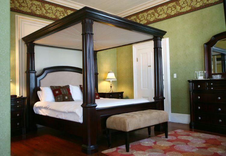 large wooden four poster bed