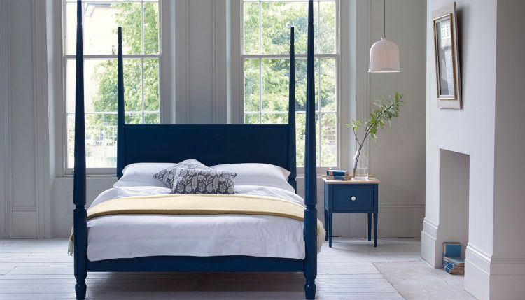 simple blue four poster bed