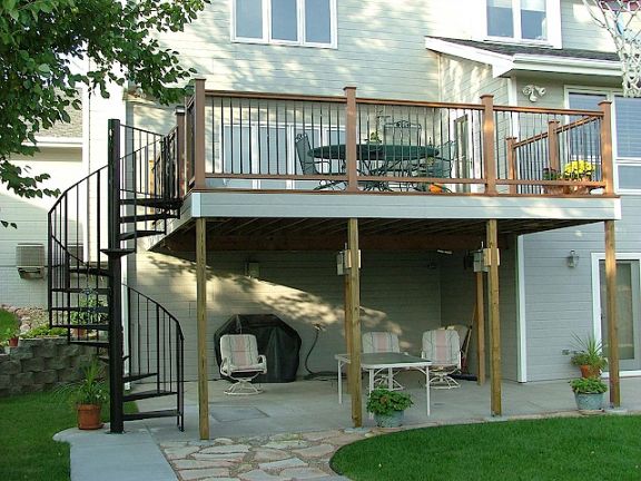 wooden deck with iron spiral staircase